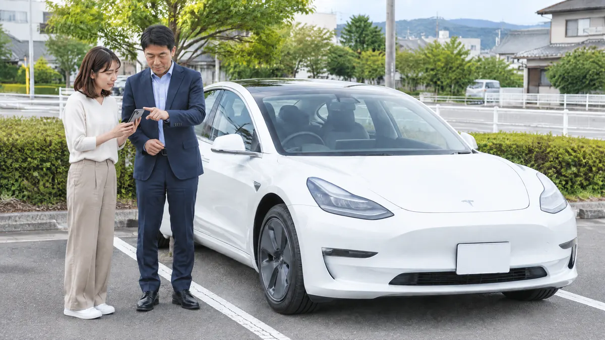 白いModel 3の横でスマートフォンの接続を確認する生成イメージ